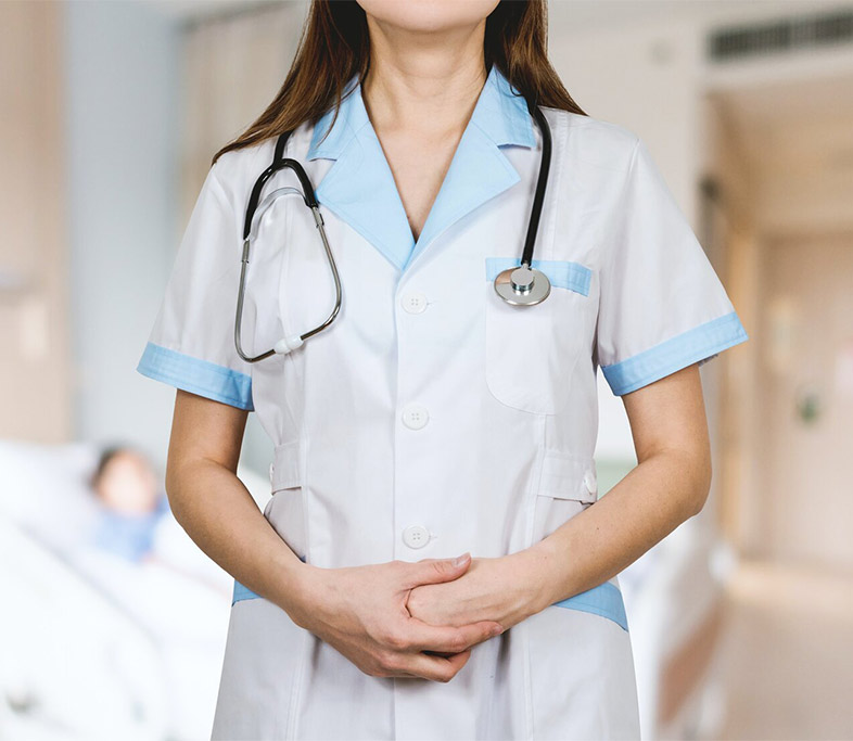 A nurse wearing a scrub dress