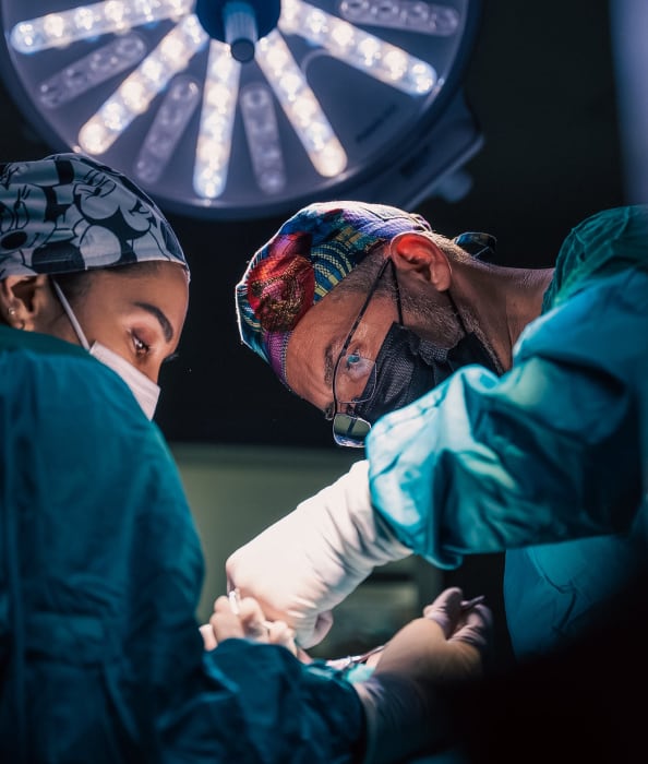 Two clinicians operating
