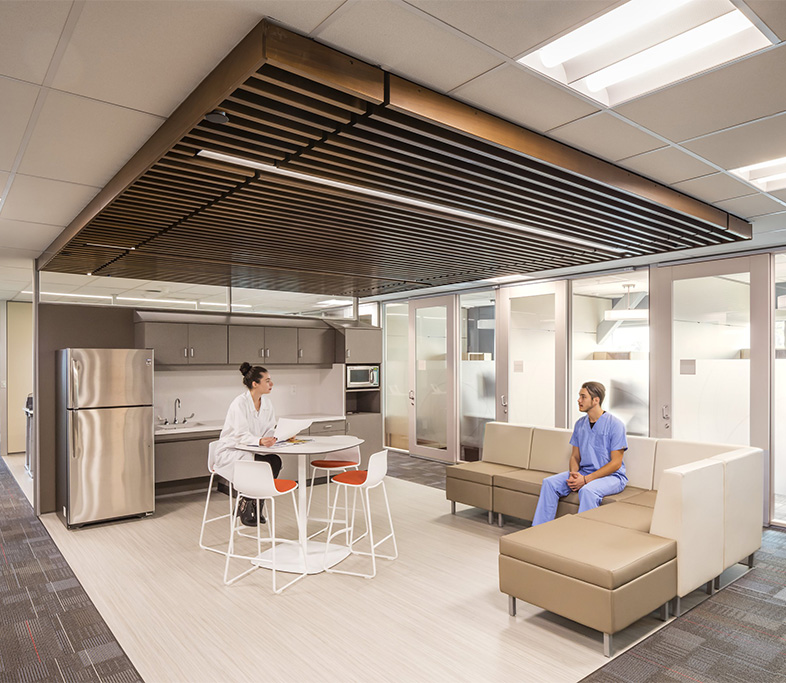 Two clinicians in a staff-only area