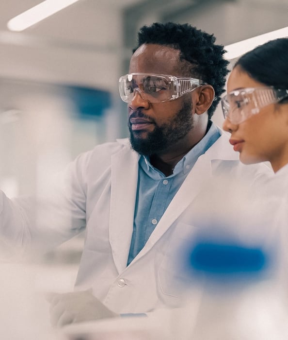 Two clinicians wearing goggles