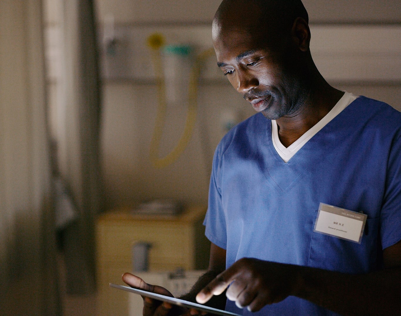 A clinician working on a tablet